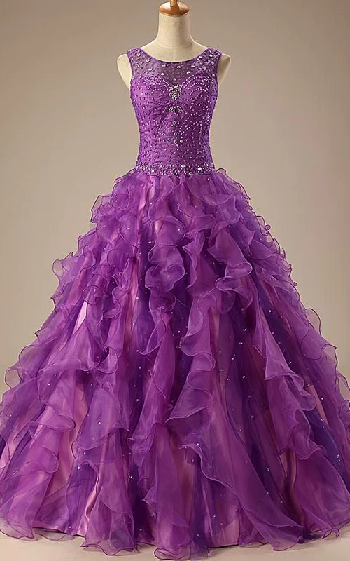 Vestido de gala largo hasta el suelo, sin mangas, con pedrería, corsé, encaje en la espalda, lentejuelas y organza satinada.