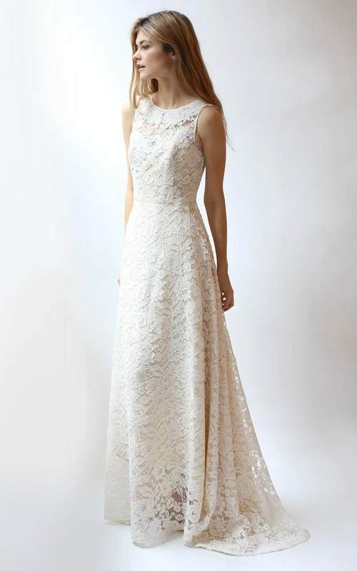 Robe en dentelle sans manches à col rond et dos nu en V, coupe trapèze.