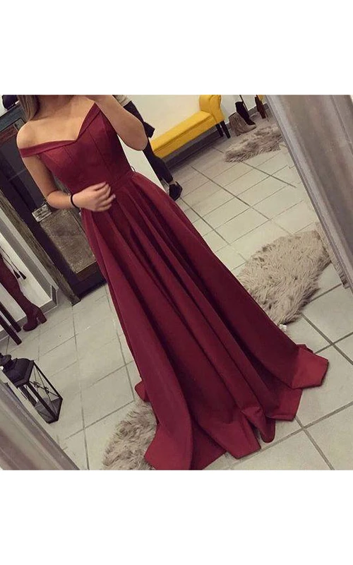 Vestido de satén de corte A con hombros descubiertos y manga corta con cremallera.