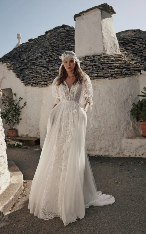 Vestido de novia de verano estilo bohemio con mangas abullonadas, corte imperio, de gasa y encaje.