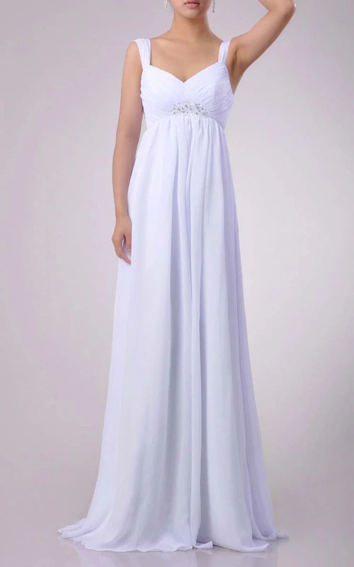 Robe longue en mousseline de soie à décolleté en cœur et coupe empire, ornée de perles