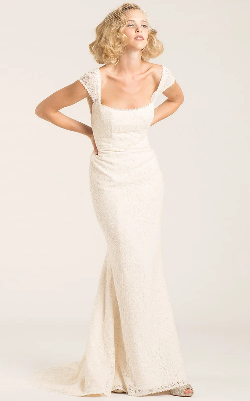 Vestido de novia de encaje estilo reina Ana, largo hasta el suelo y corte recto.