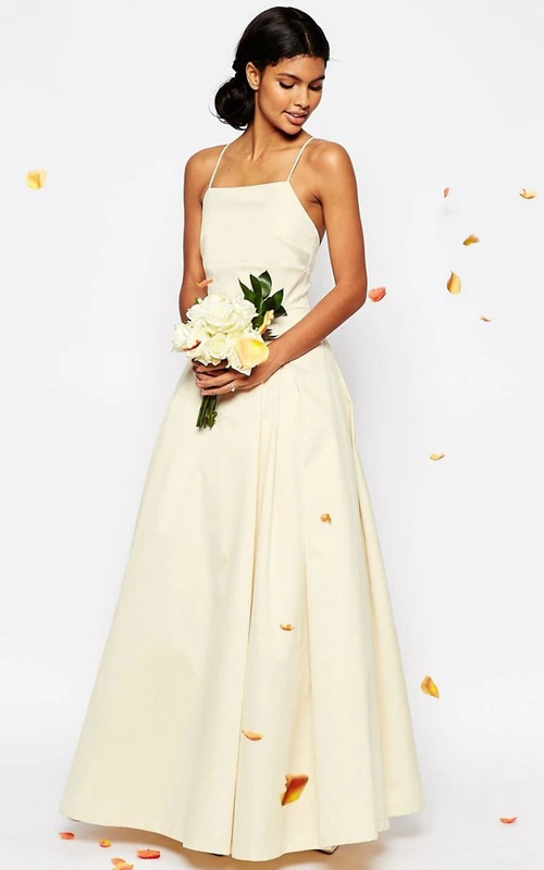 Robe de mariée longue trapèze à fines bretelles sans manches