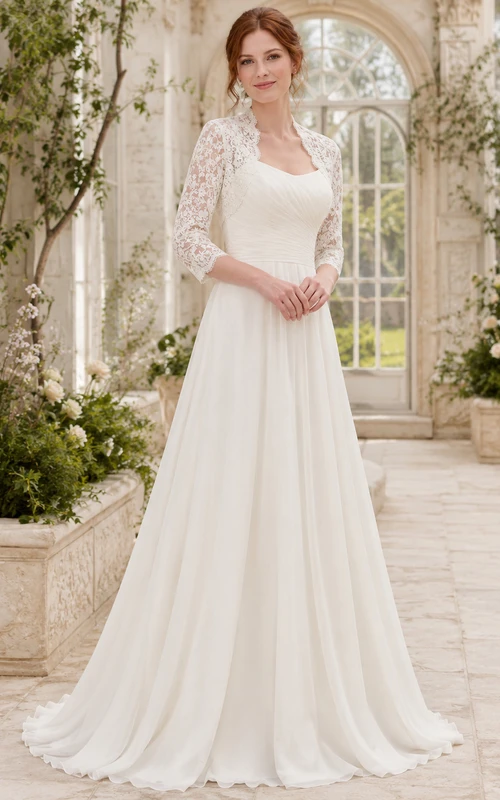 Robe de mariée en mousseline et dentelle, coupe trapèze, col rond, manches longues et traîne.
