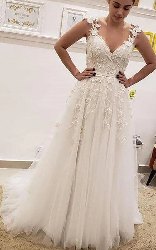 Robe de mariée empire en tulle illusion trapèze ornée de perles