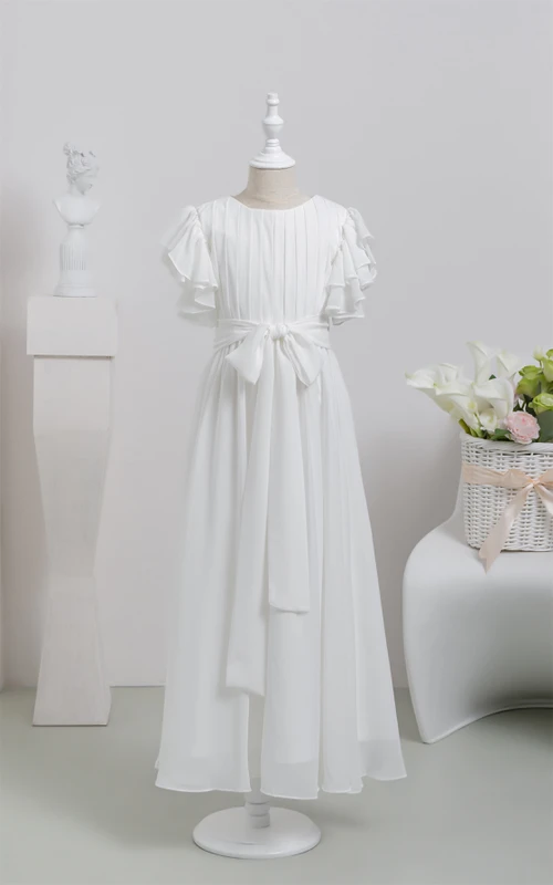 Vestido blanco de niña de las flores para Primera Comunión con lazo y mangas con volantes.