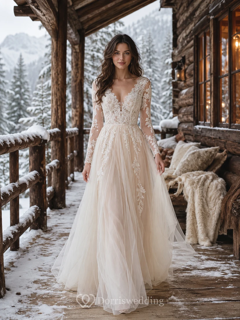 Vestido de novia de invierno color champán con apliques de tul y mangas de encaje.