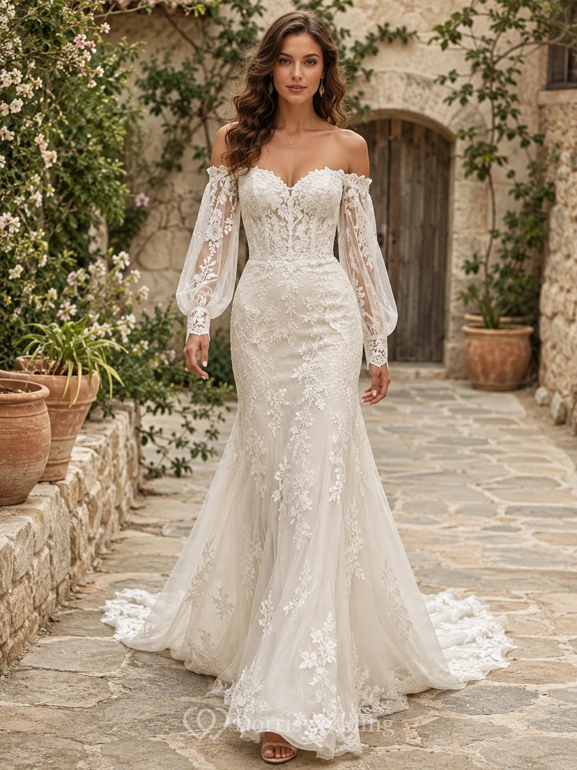 Vestido de novia bohemio de corte sirena con hombros descubiertos, mangas abullonadas de encaje y falda larga.