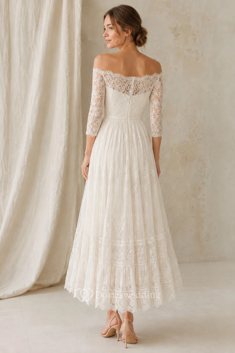 Robe de mariée en dentelle mi-longue à épaules dénudées et manches trois-quarts view 2