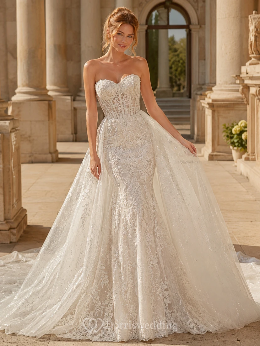 Robe de mariée de soirée en dentelle et tulle, bustier cœur, coupe trapèze, traîne chapelle, jupon amovible