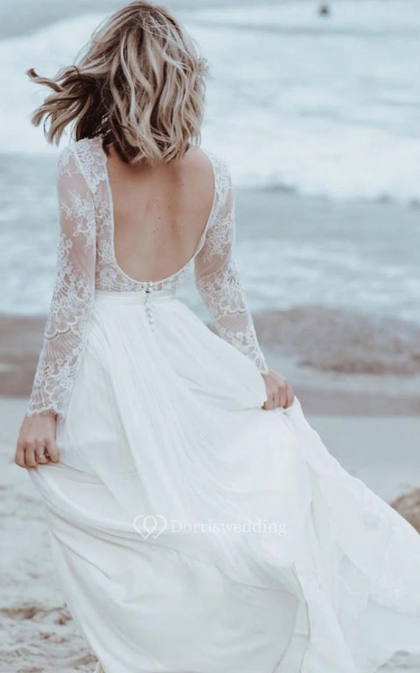 Robe de mariée simple en tulle et dentelle, coupe trapèze, longueur au sol, manches longues, fente sur le devant et plis view 2