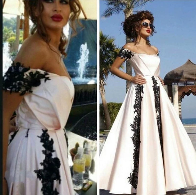 Vestido de noche moderno de corte A con apliques negros y hombros descubiertos. view 2