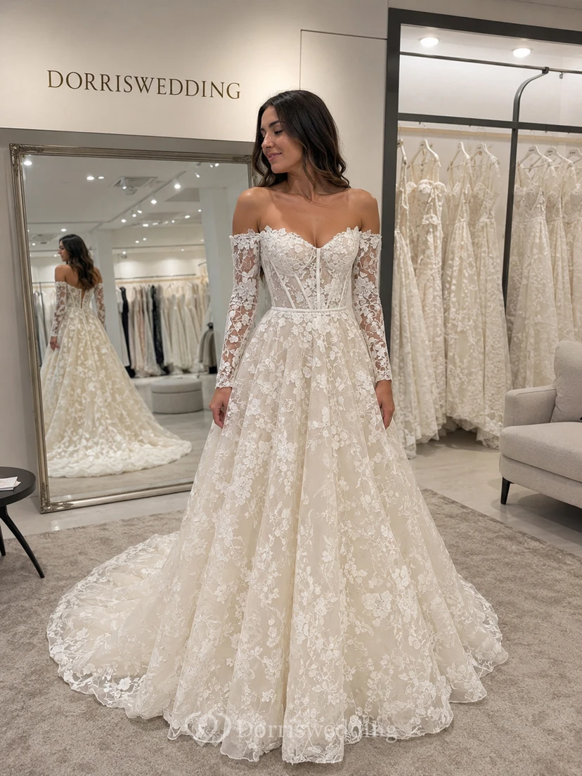 Vestido de novia de encaje color champán con escote Bardot, corte en A y mangas largas. view 6