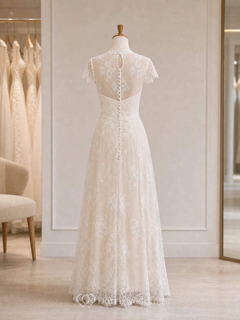 Vestido de novia de corte imperio con mangas cortas y espalda abotonada transparente. view 8