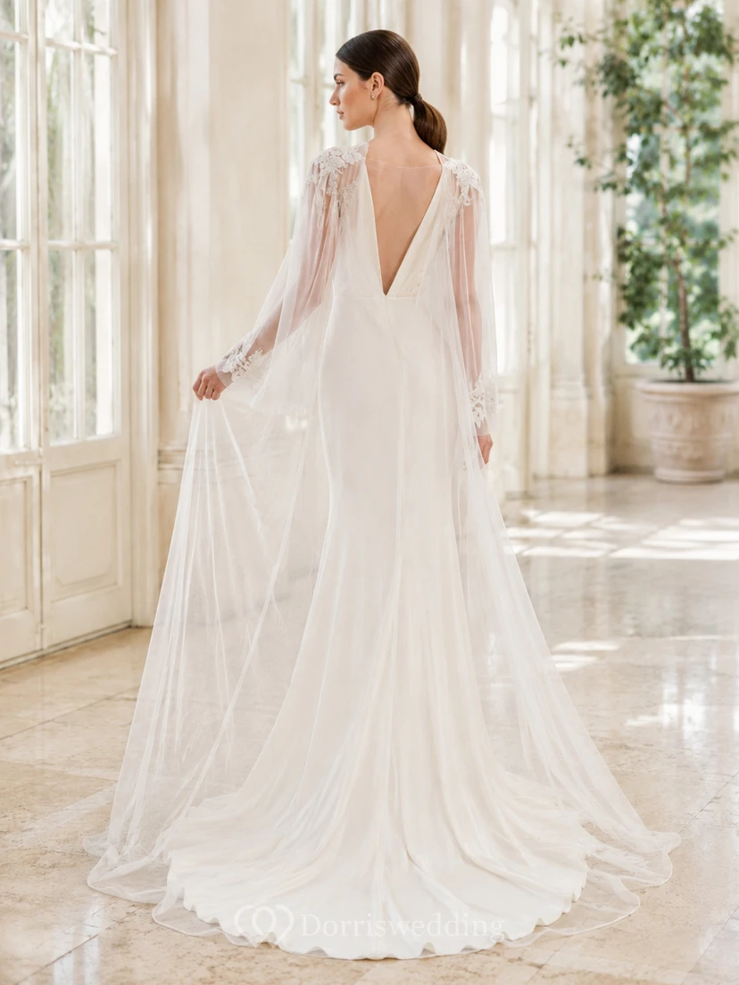 Robe de mariée de soirée en mousseline polie, décolleté en V profond, manches cape, coupe trapèze et traîne chapelle view 2