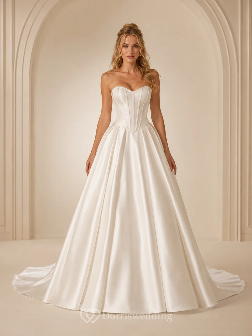 Vestido de novia minimalista de satén, estilo princesa, sin tirantes, con escote corazón y cola larga.