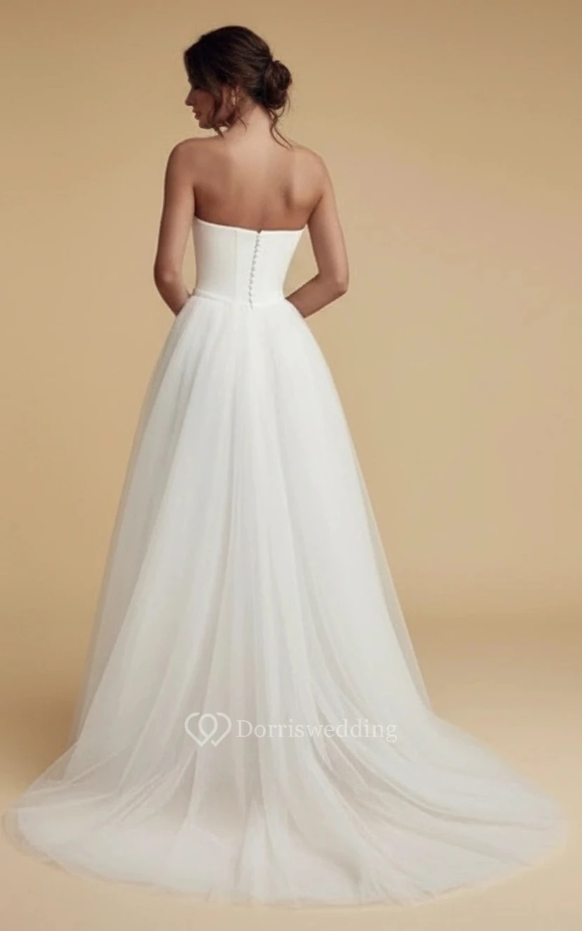 Mono de novia sin tirantes con cintura fina, talle alto y pernera ancha, con falda de tul. view 2