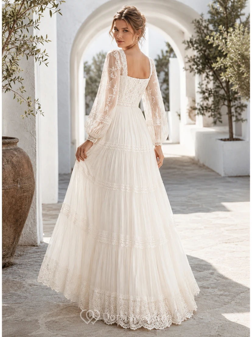 Robe de mariée longue en tulle à volants, coupe trapèze, col carré, manches longues et dos zippé festonné view 2