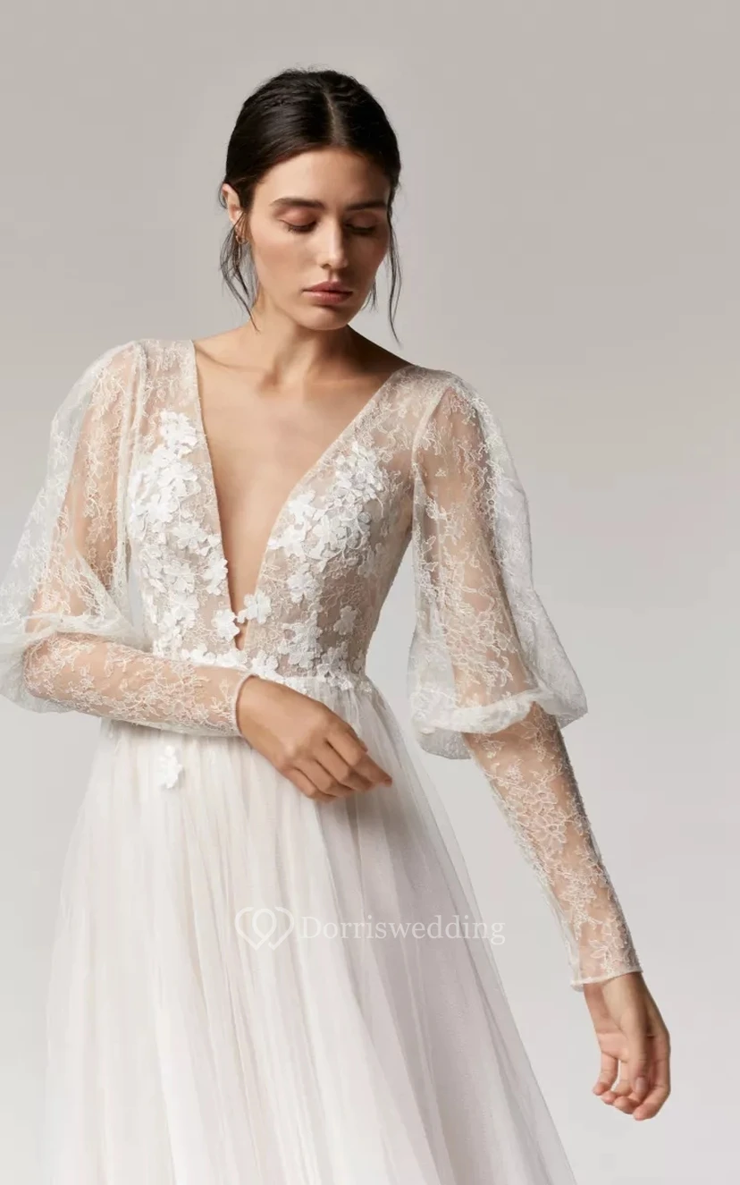 Vestido de novia bohemio de corte A con escote pronunciado, mangas largas abullonadas y falda de tul. view 3