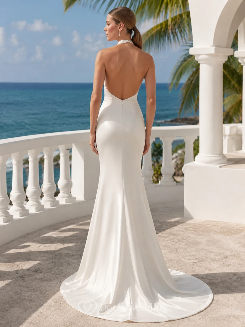 Robe de mariée minimaliste en satin, dos nu, traîne, col châle et jupe sirène. view 2