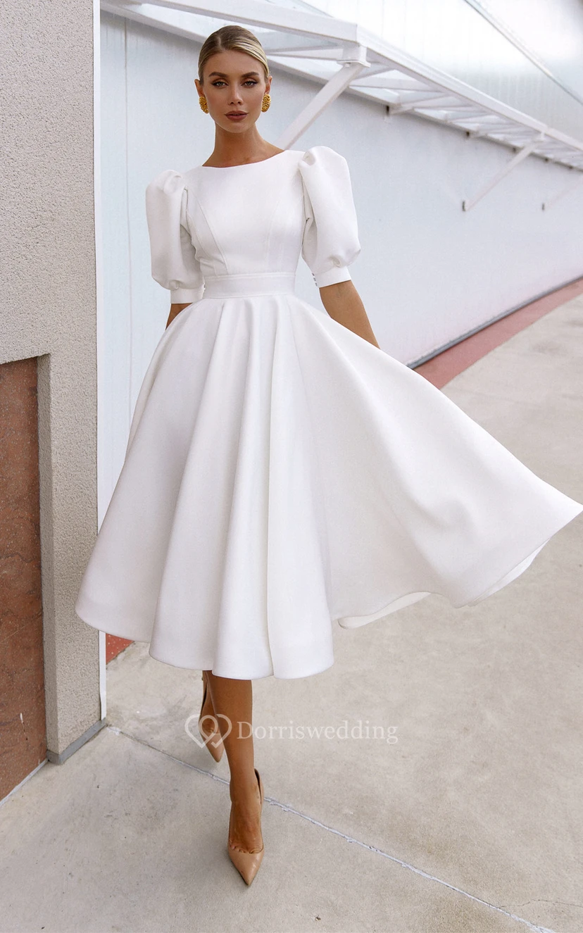 Elegante vestido de novia de satén con corte en A y escote barco hasta la rodilla