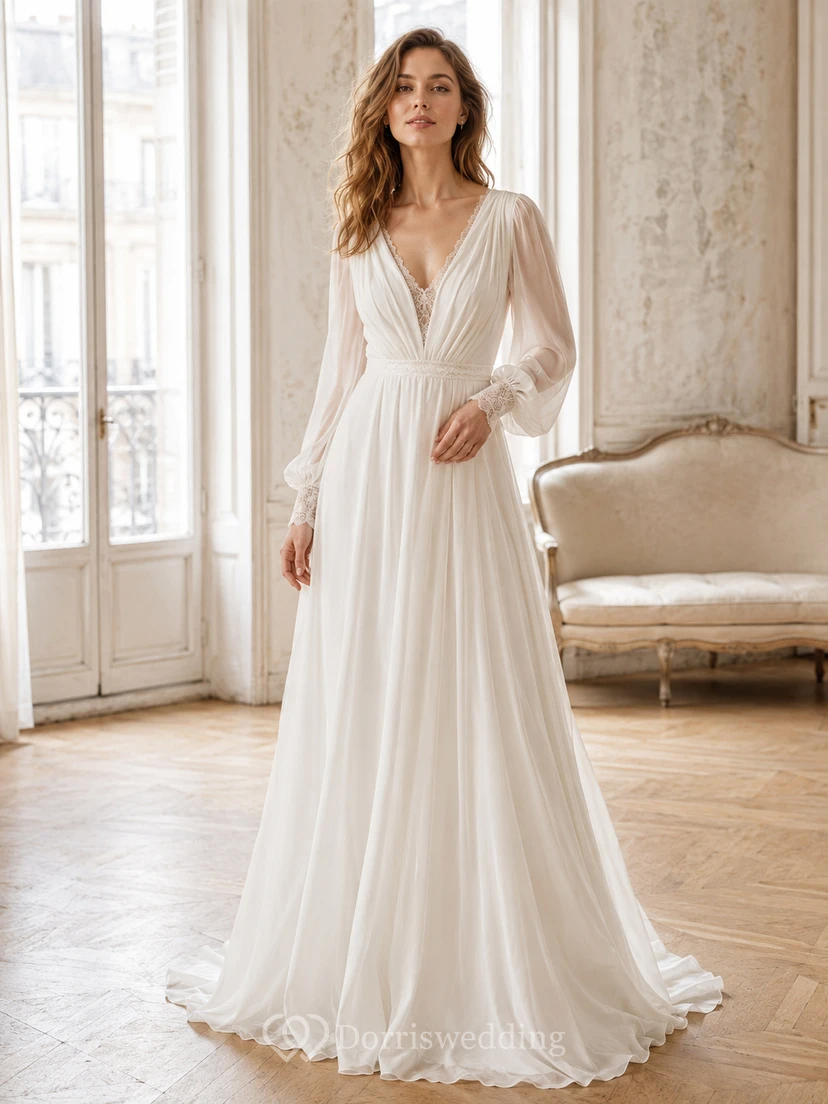 Robe de mariée de soirée raffinée en mousseline de soie, décolleté plongeant en V, manches gigot, coupe trapèze, traîne drapée, dos nu plongeant en V.