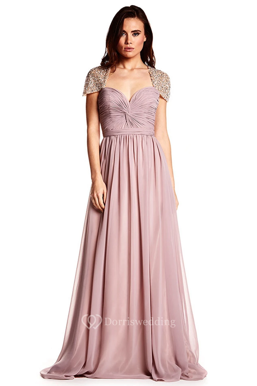 Robe de bal en mousseline à manches courtes et décolleté cœur froncé, ornée de fronces