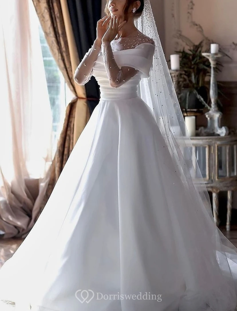 Robe de bal à épaules dénudées avec manches illusion ornées de perles