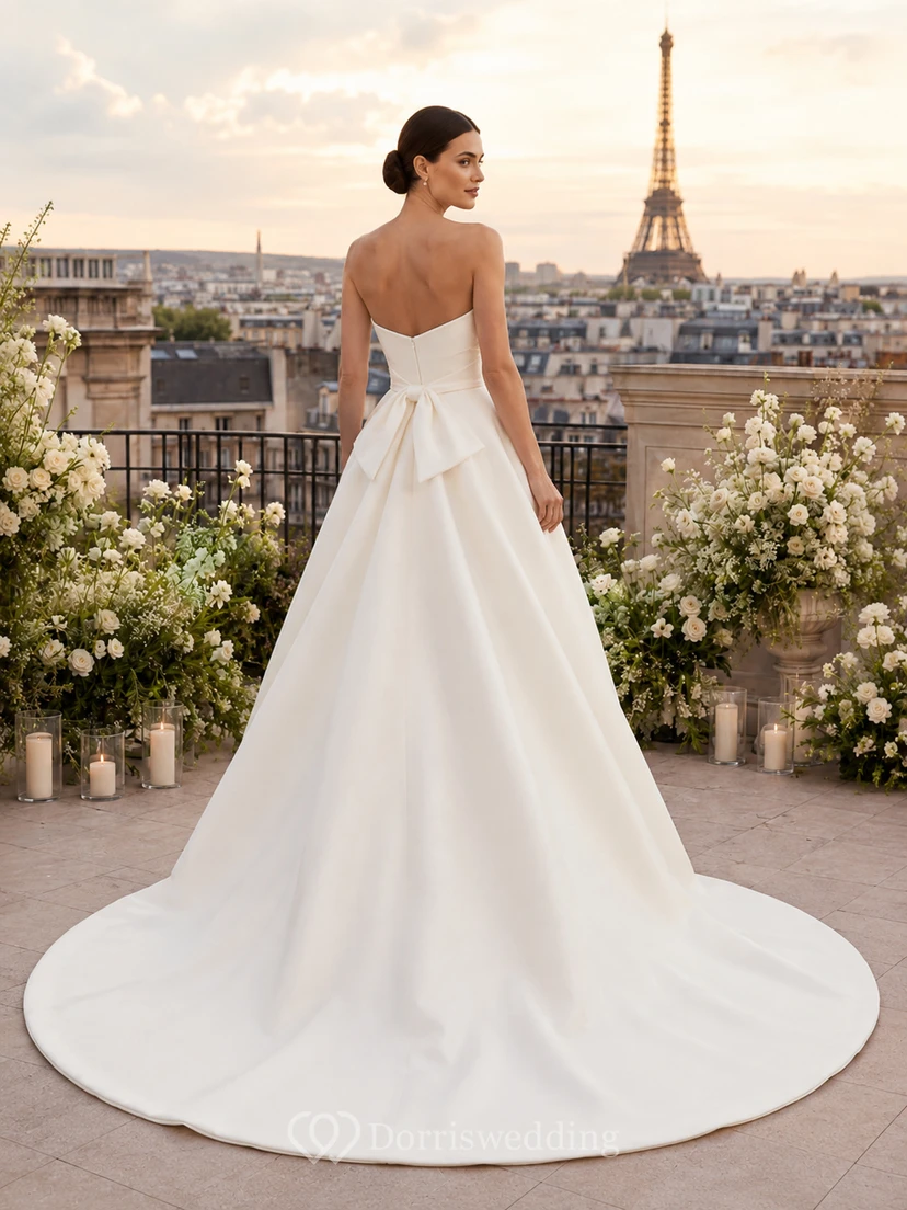 Robe de bal moderne bustier drapée en satin avec nœud et traîne chapelle, idéale pour un mariage à destination view 2
