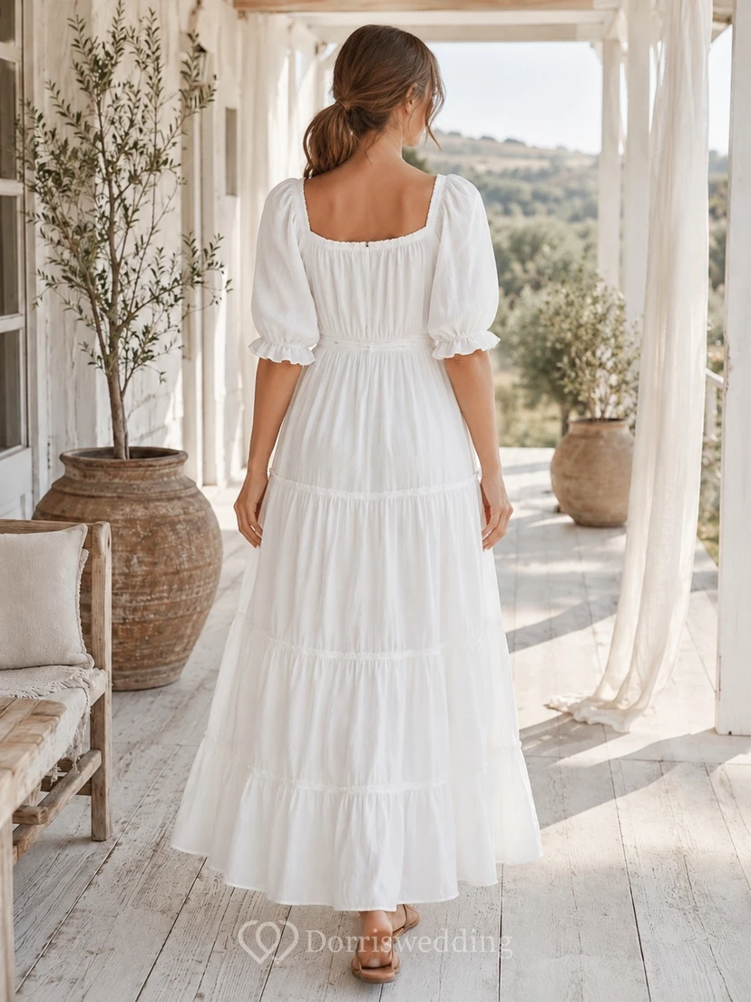 Vestido blanco de gasa con escote cuadrado, manga corta, corte en A y largo hasta los tobillos con volantes. view 2