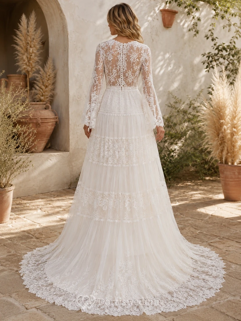 Vestido de novia blanco romántico de manga larga, escote en V, corte en A y encaje con volantes view 2