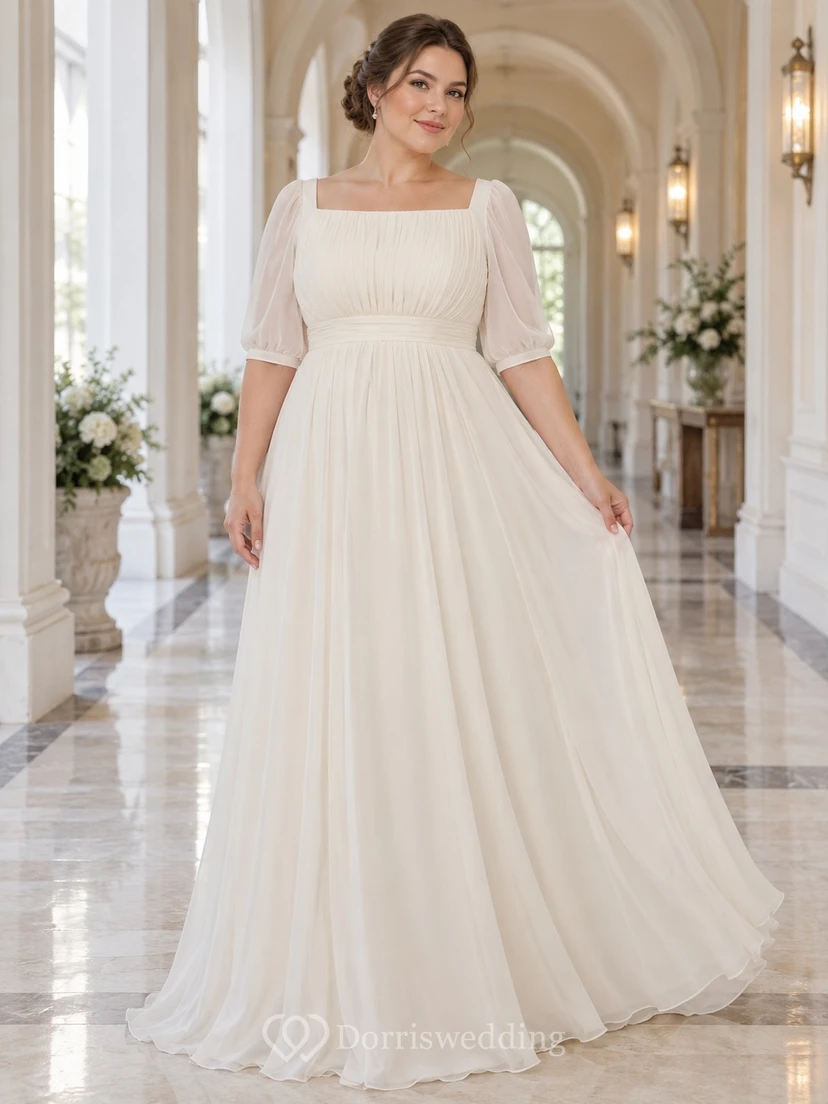 Vestido de novia de gasa de corte imperio con escote cuadrado discreto y mangas transparentes hasta la mitad.