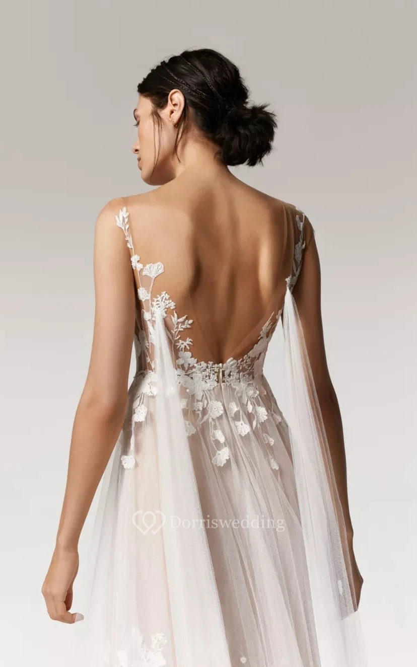 Robe de mariée vaporeuse sans manches en tulle, plissée empire et ornée d'appliqués de dentelle. view 3