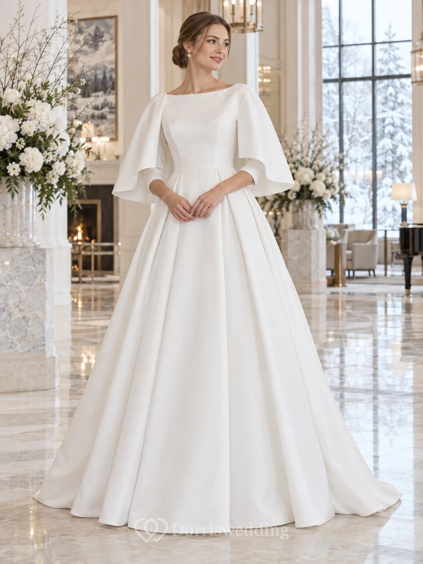 Vestido de novia sencillo y modesto de corte A con escote barco y capa corta de satén plisada.