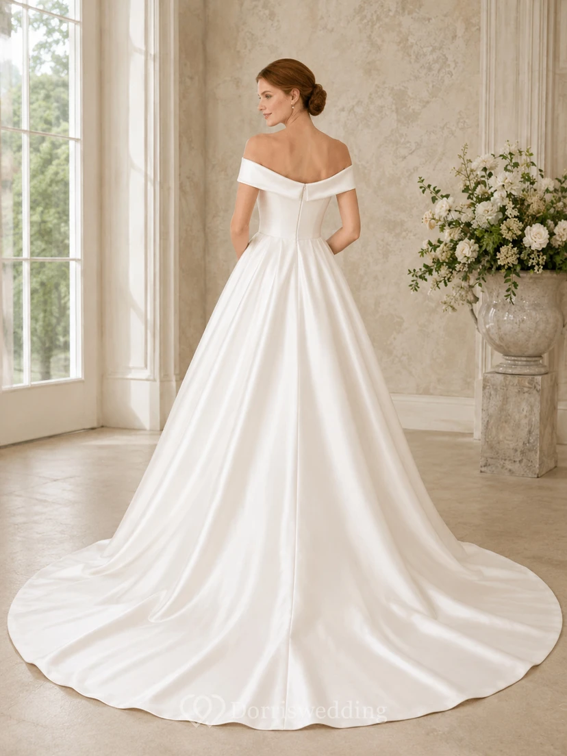 Vestido de novia minimalista de satén, estilo princesa, con hombros descubiertos y cola. view 2