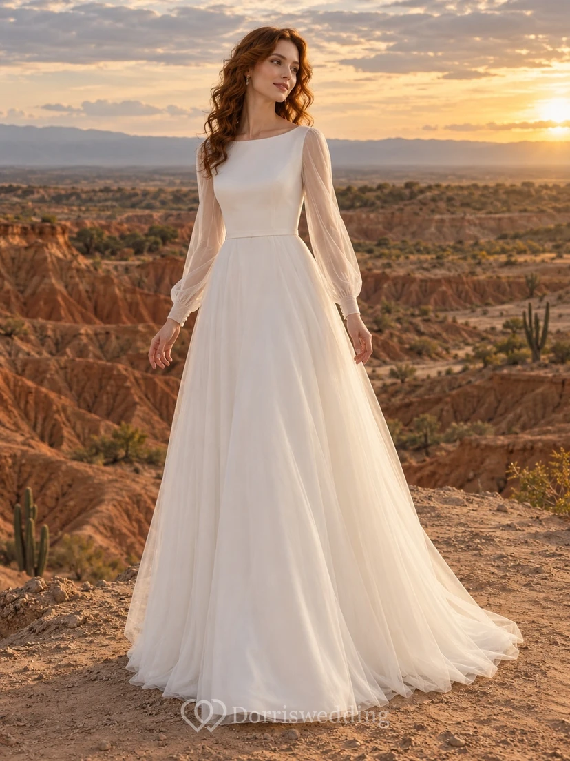 Vestido de novia de tul de manga larga con escote barco, corpiño y cola en línea A.