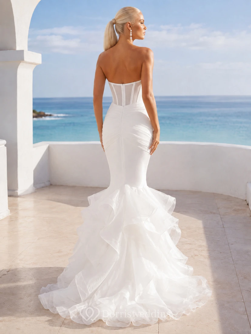Vestido de novia de lujo sin tirantes, escote corazón, organza con ballenas, corte sirena, asimétrico, con volantes en cascada y cola larga. view 2