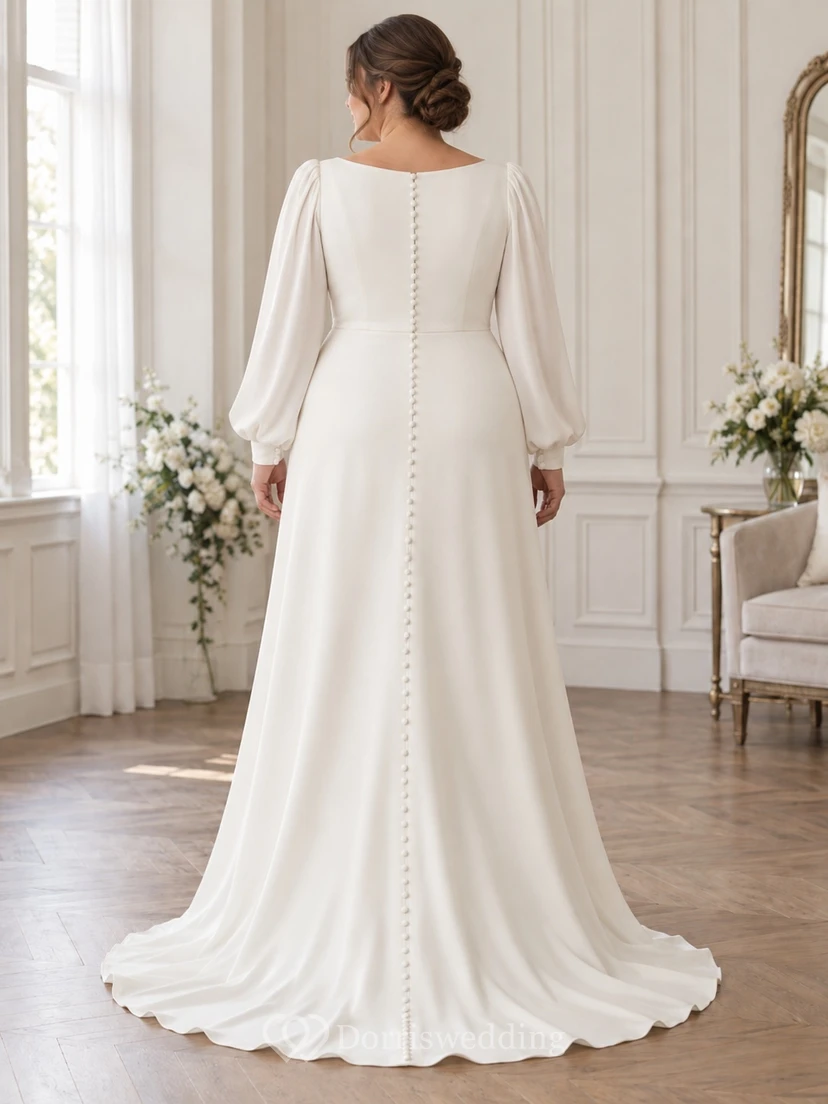 Vestido de novia de corte A con escote barco, mangas largas y espalda abotonada. view 2