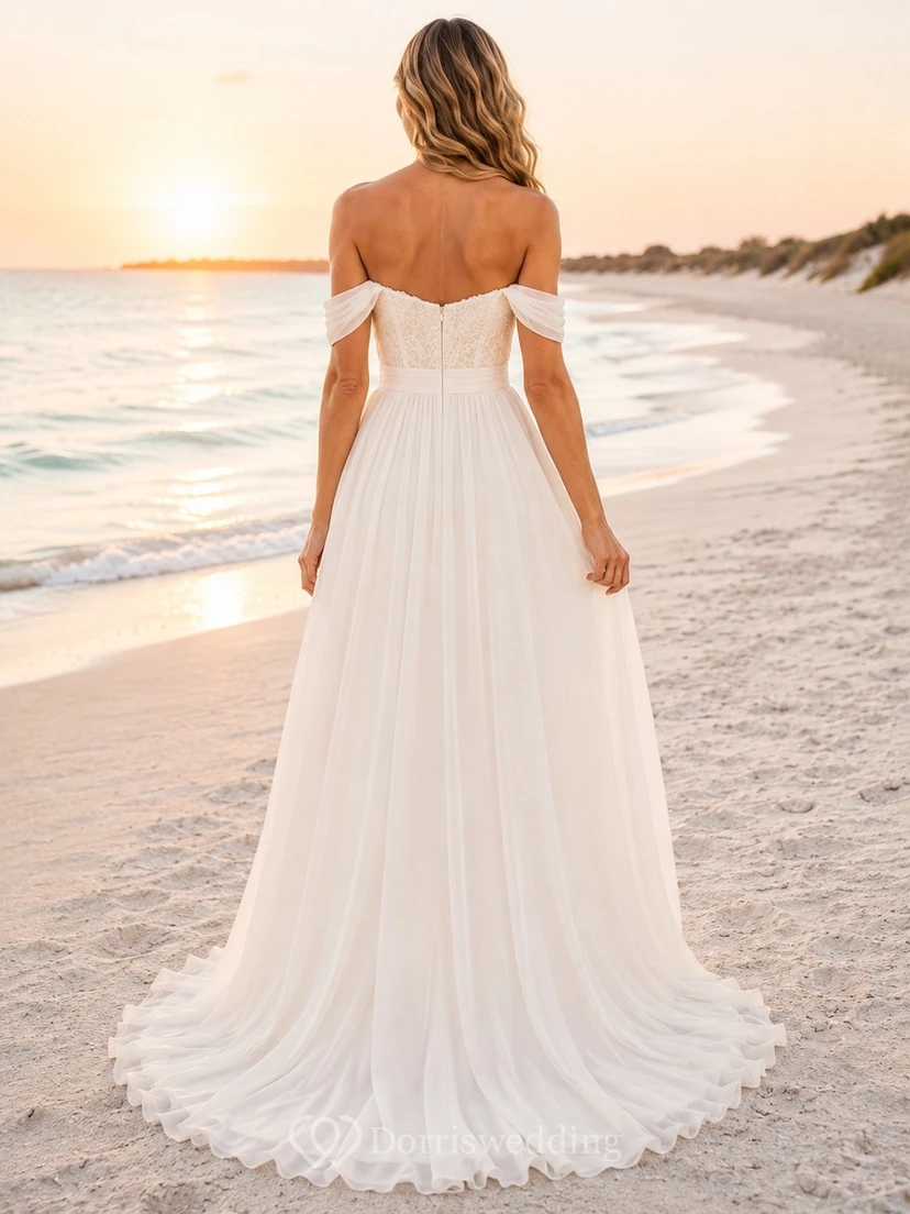 Vestido de novia de gasa con escote Bardot y cola larga, ideal para fugarse a la playa. view 2