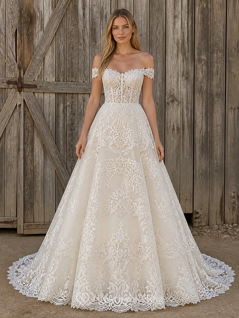 Vestido de novia romántico de manga corta, corte en A, hombros descubiertos, encaje de enredaderas y cola catedral.