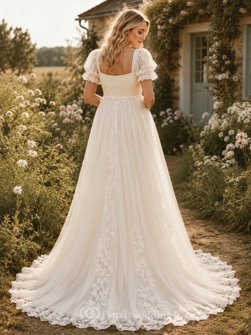 Vestido de novia premamá con escote cuadrado, mangas abullonadas, encaje, corte en A y cola de jardín. view 2
