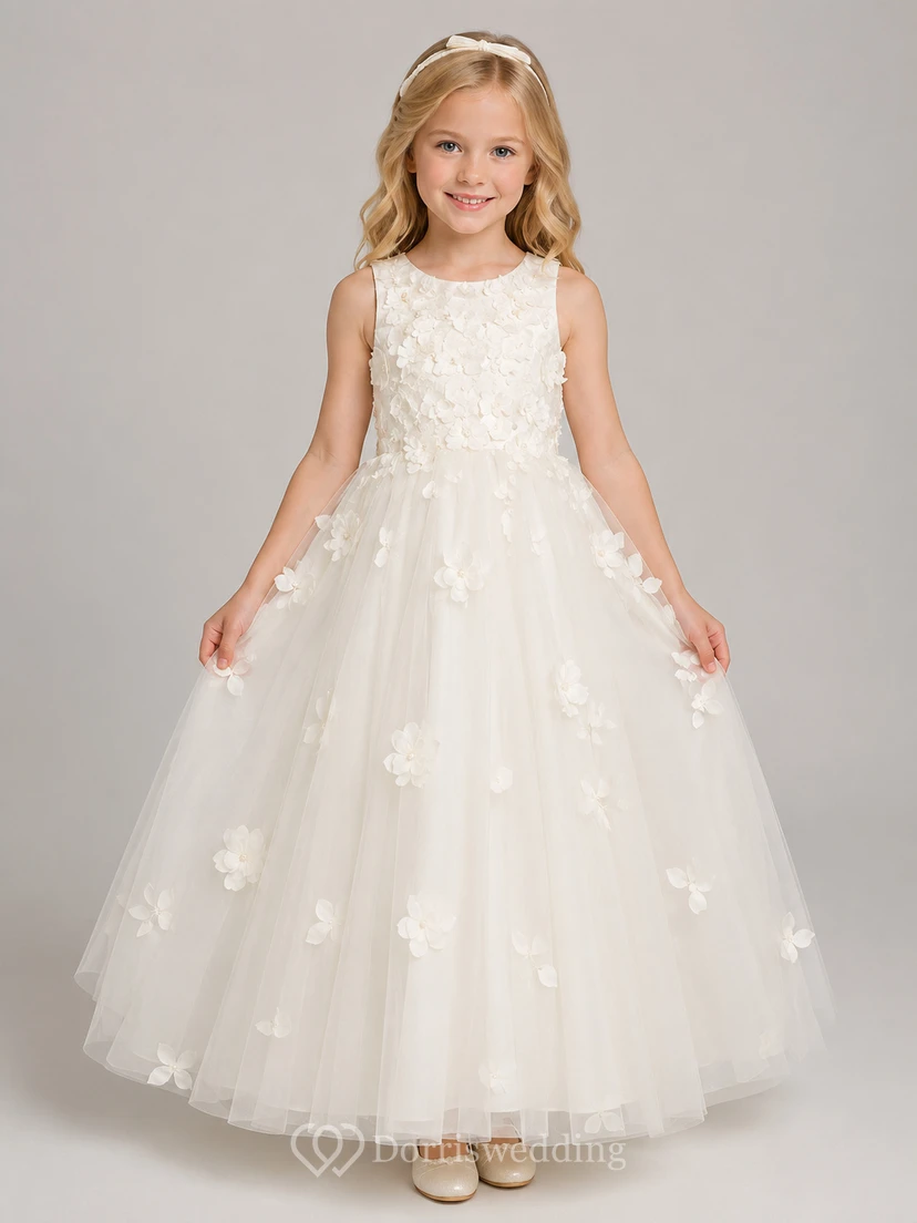 Vestido de niña de flores de tul con mangas abullonadas, corte en A, cuello joya, falda a media pierna y detalle de lazo.