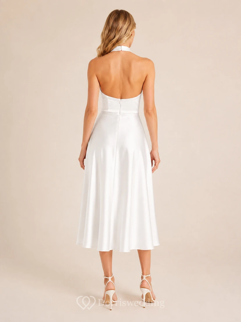 Vestido de fiesta vintage blanco sin mangas de satén con escote halter y corte en A, largo hasta la rodilla. view 2