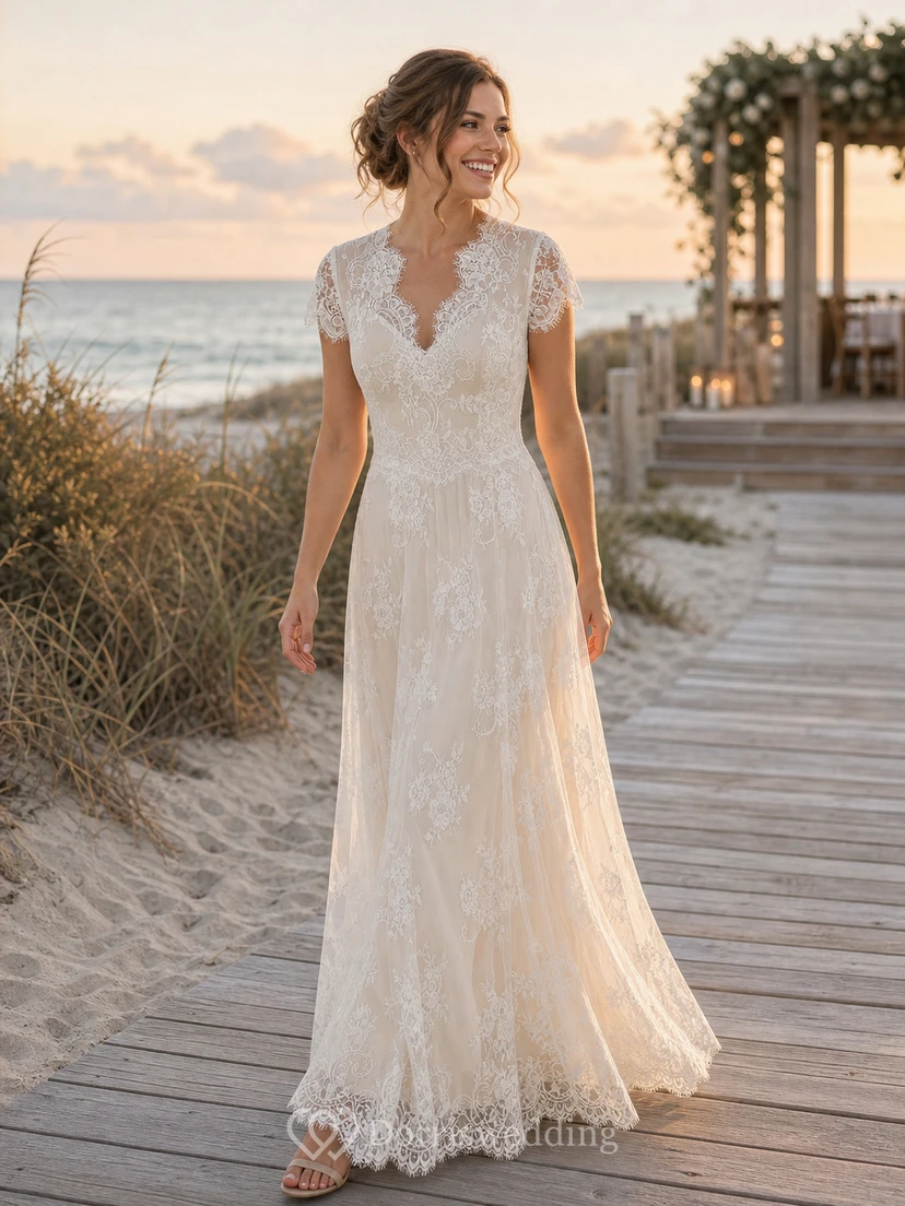 Vestido de novia de corte imperio con mangas cortas y espalda abotonada transparente. view 9