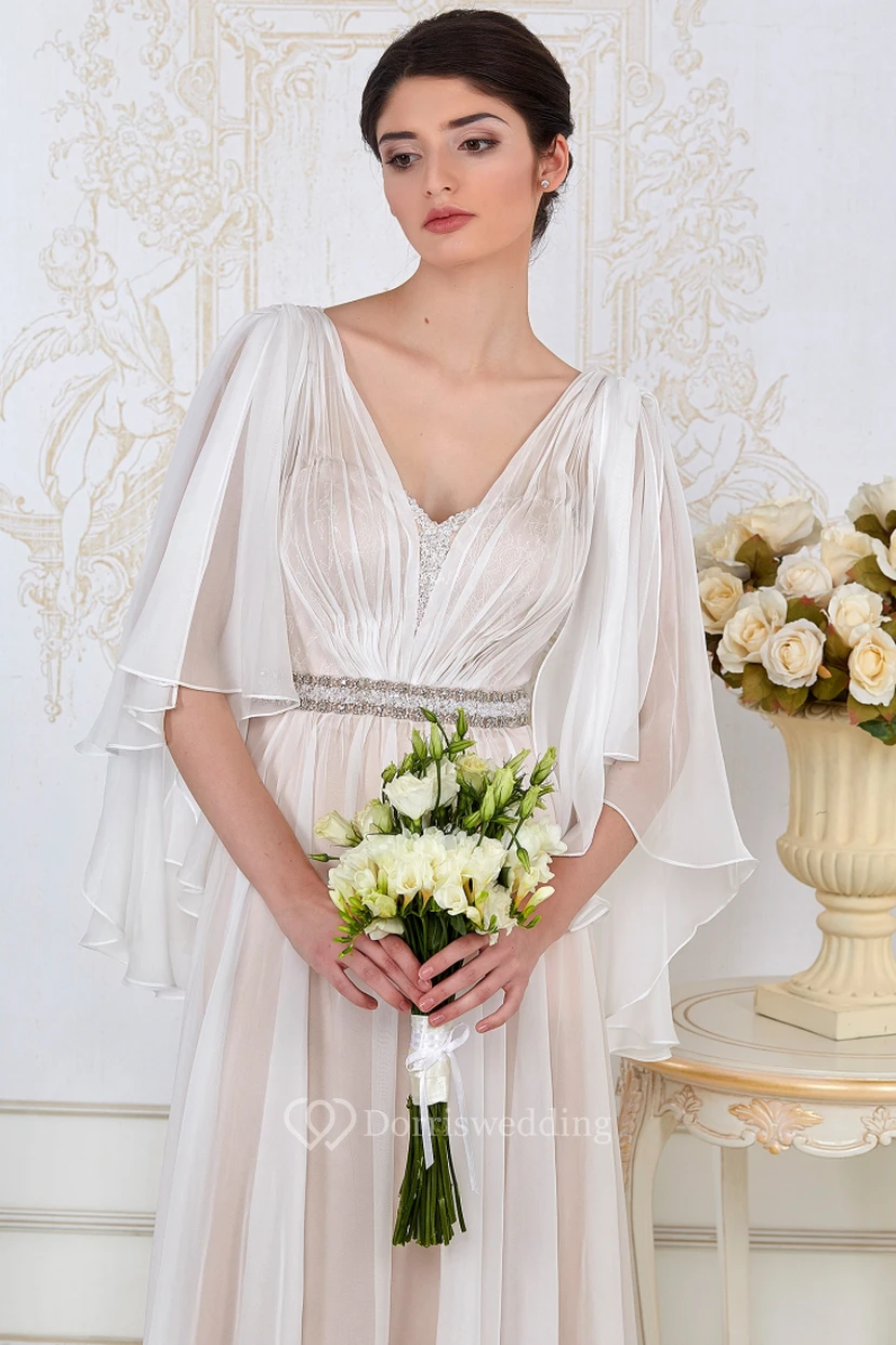 Robe de soirée longue en tulle, coupe trapèze, manches bouffantes, col en V orné de perles et de fronces. view 4