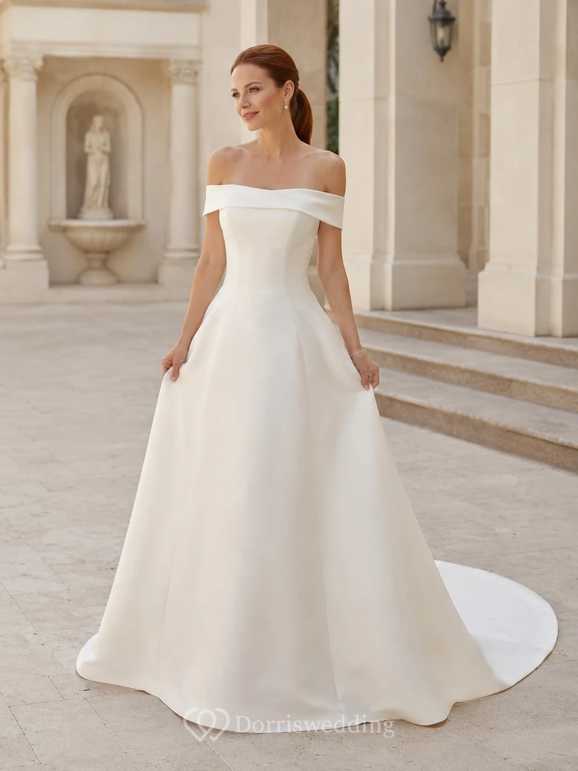 Vestido de novia minimalista de satén, corte en A, hombros descubiertos, cola larga.