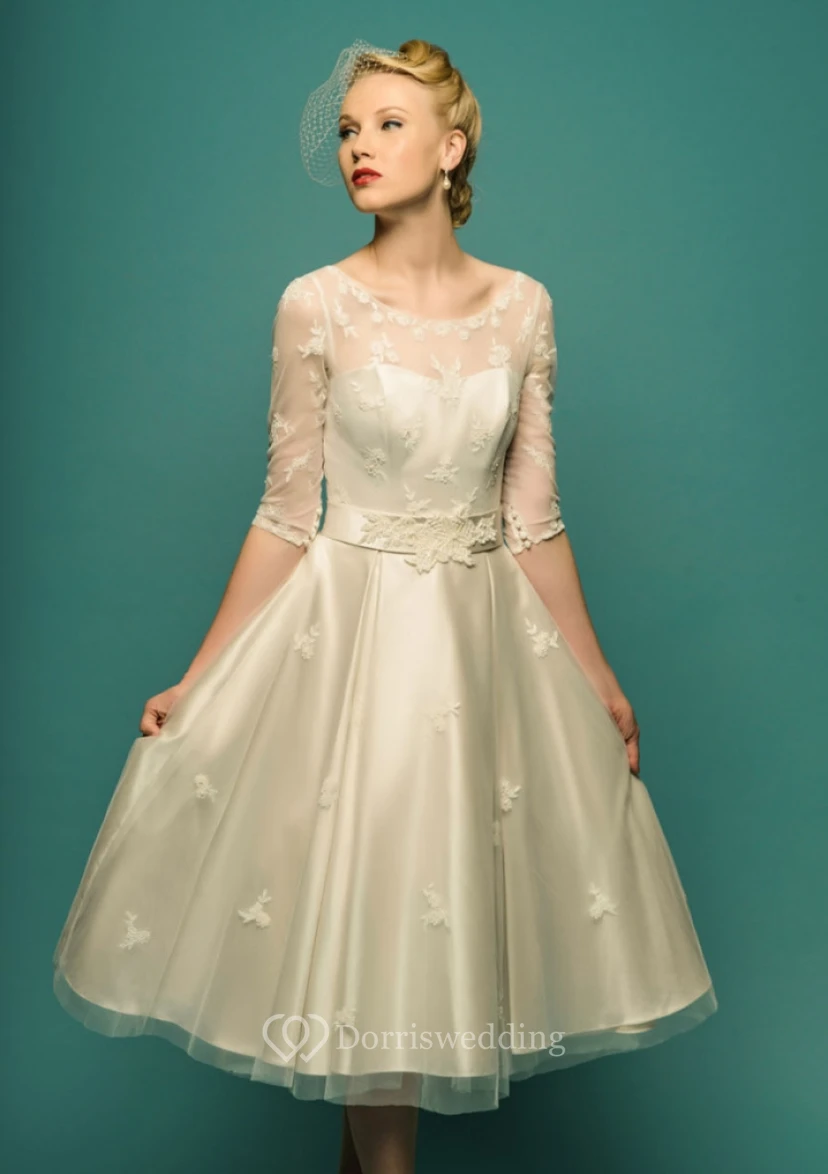 Vestido de novia de corte A, largo hasta la rodilla, con mangas ilusión, escote redondo y apliques de tul. view 5