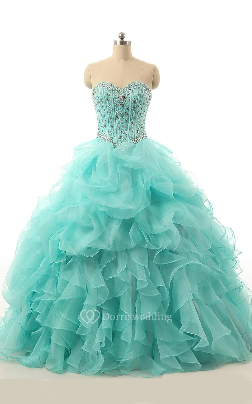 Vestido largo de gala con escote corazón, pedrería, cremallera y espalda con cordones, de organza y encaje.