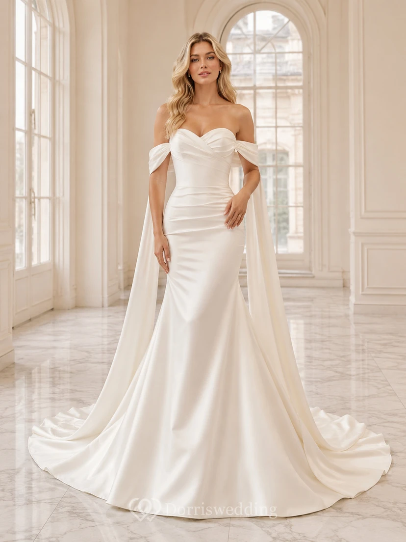 Robe de mariée fourreau luxueuse en satin, épaules dénudées, manches cape, traîne chapelle amovible, style jardin.