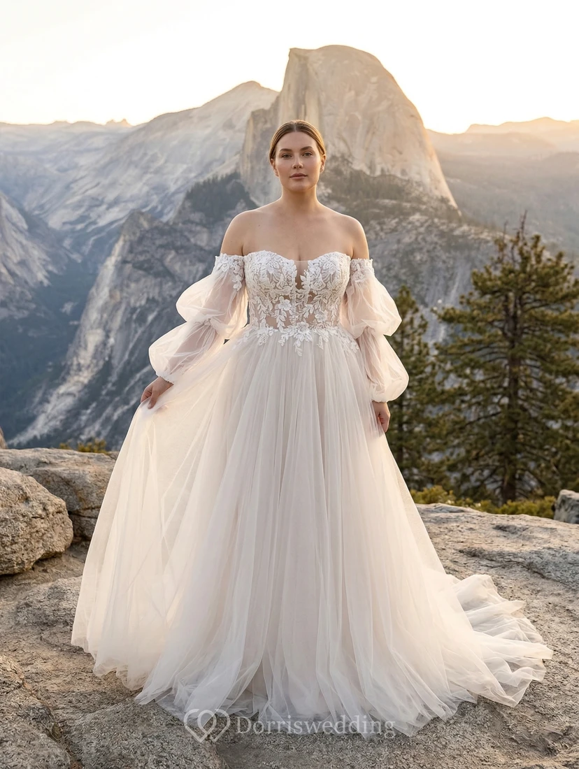 Vestido de novia de talla grande con hombros descubiertos, mangas abullonadas, corte en A, corpiño de encaje y cola de capilla de tul.